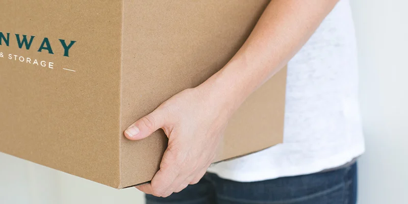 Person-holding-Steinway-moving-box