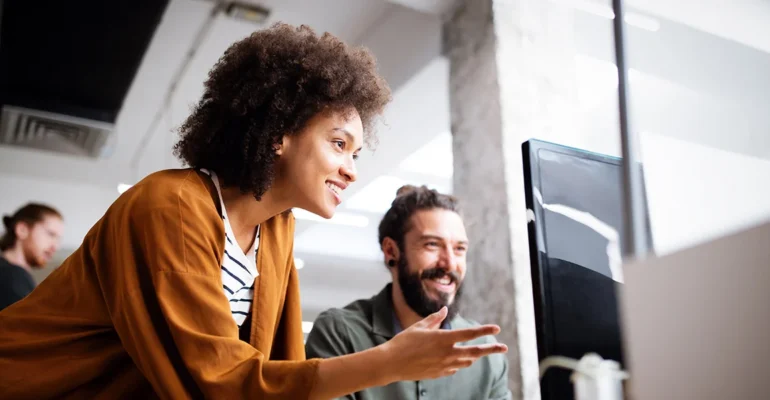 Woman-helping-Man-out-with-computer-problem