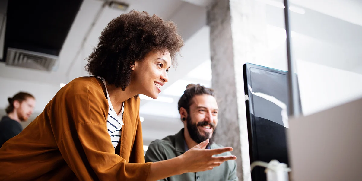 Woman-helping-Man-out-with-computer-problem